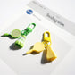 Lifelike badminton racket keychain held in a person's hand showing size
