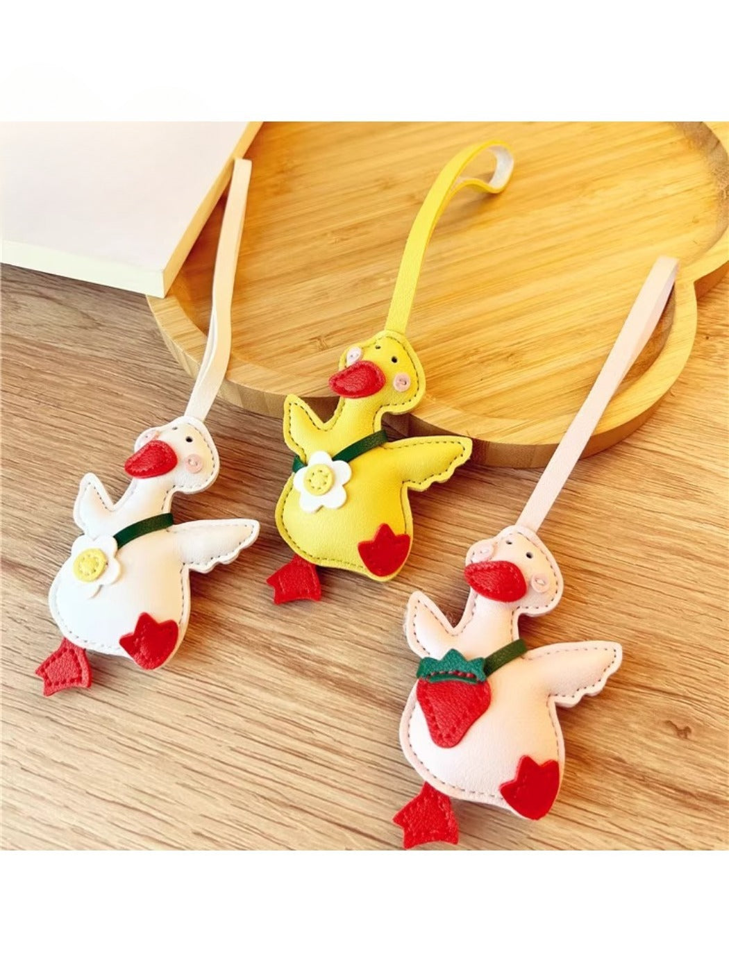 Close-up of the yellow duck keychain showing detailed facial features