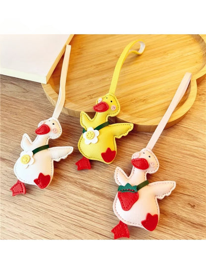 Close-up of the yellow duck keychain showing detailed facial features