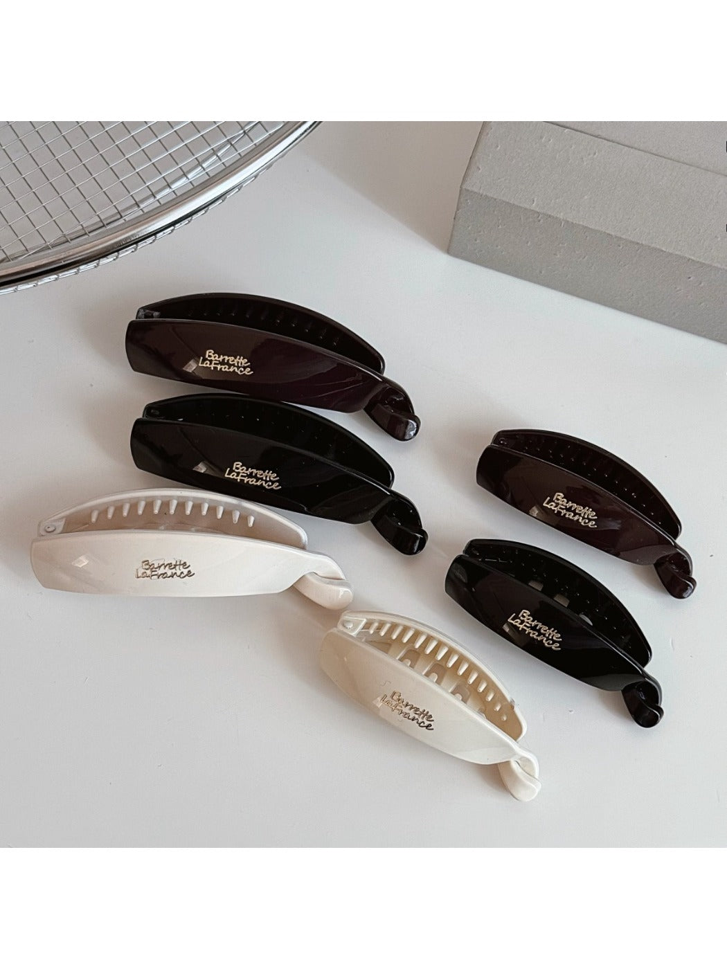 Beau minimalist stick hair clip in matte black on white background