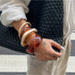 Side view of Lovra ombre bangle bracelet displaying sleek metal finish