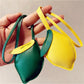 Lemon-shaped keychain hanging from a set of keys on a wooden surface