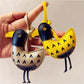 Little ostrich shaped keychain with a smooth finish and detailed features