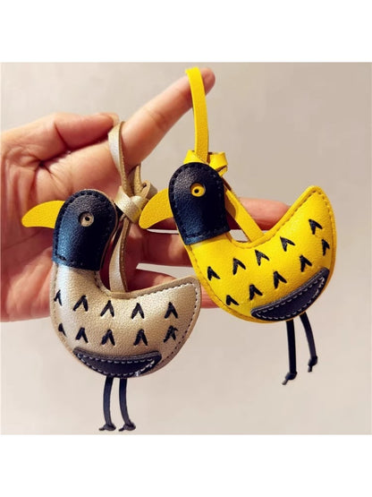 Little ostrich shaped keychain with a smooth finish and detailed features