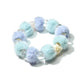 Close-up of Lovra beaded bracelet showing detailed pastel beads and elastic band