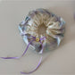 Gifty checkered bow ribbon scrunchie folded to show inner elastic