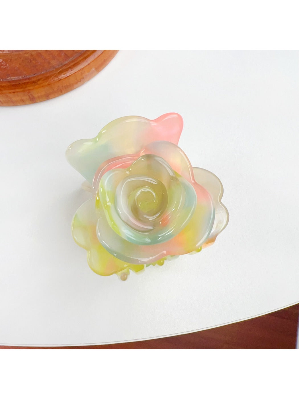 Top view of Beau flower-shaped claw clip displaying symmetrical petal arrangement