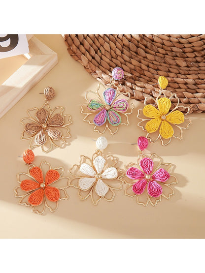 Close-up of Earedge flower shaped drop earrings with intricate petal design