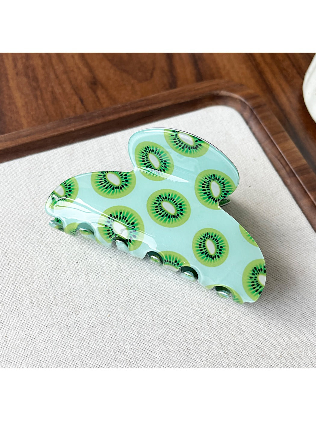 Beau acrylic claw clip with multicolored fruit illustrations on clear base