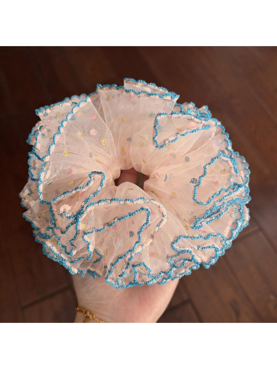 Gifty Hazy Elegant Mesh Scrunchie displayed on a wooden surface with natural lighting