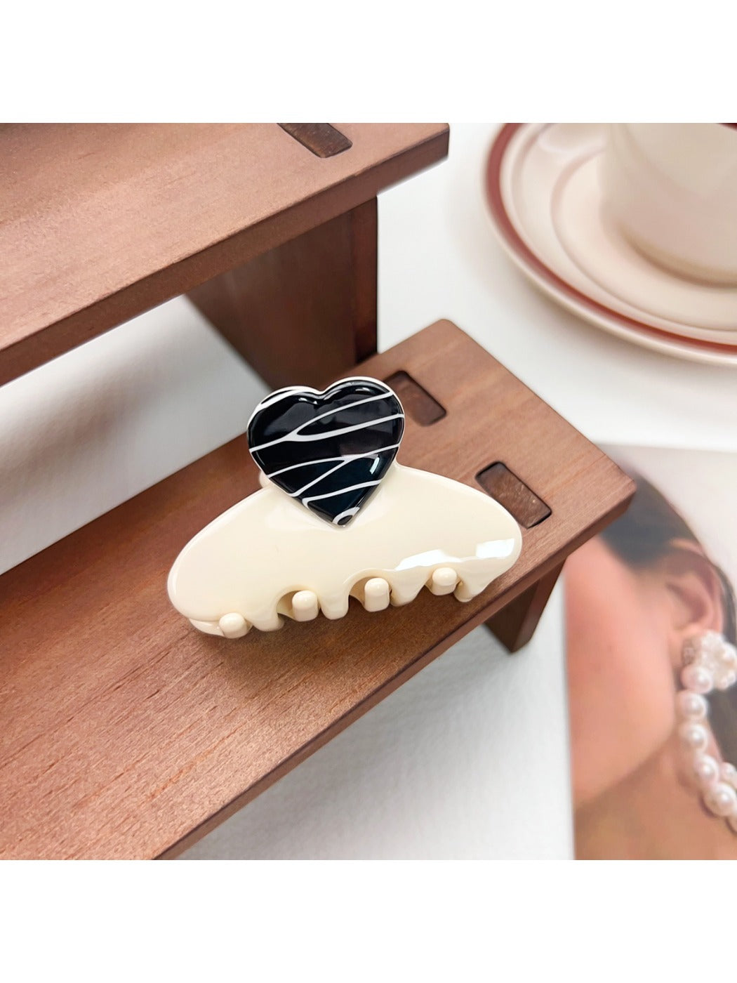 Beau medium heart shaped half circle claw clip styled in model's hair from back