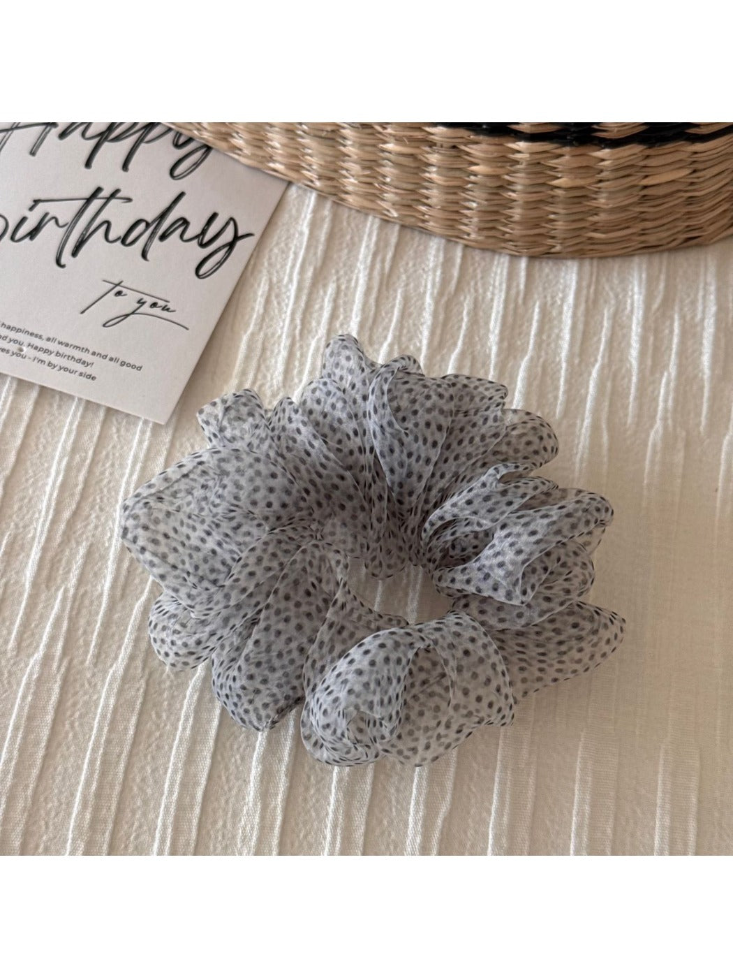 Scrunchie photographed with natural lighting highlighting colors