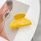 Model wearing Beau crescent shaped hair claw clip with loose wavy hair