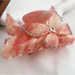Beau colorful butterfly hair claw clip placed on a wooden surface