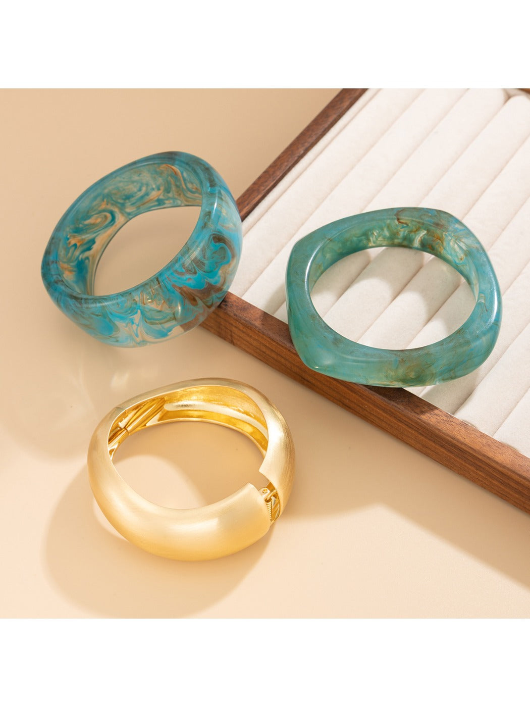 Close-up of Lovra minimalist textured irregular silver bracelet on wrist