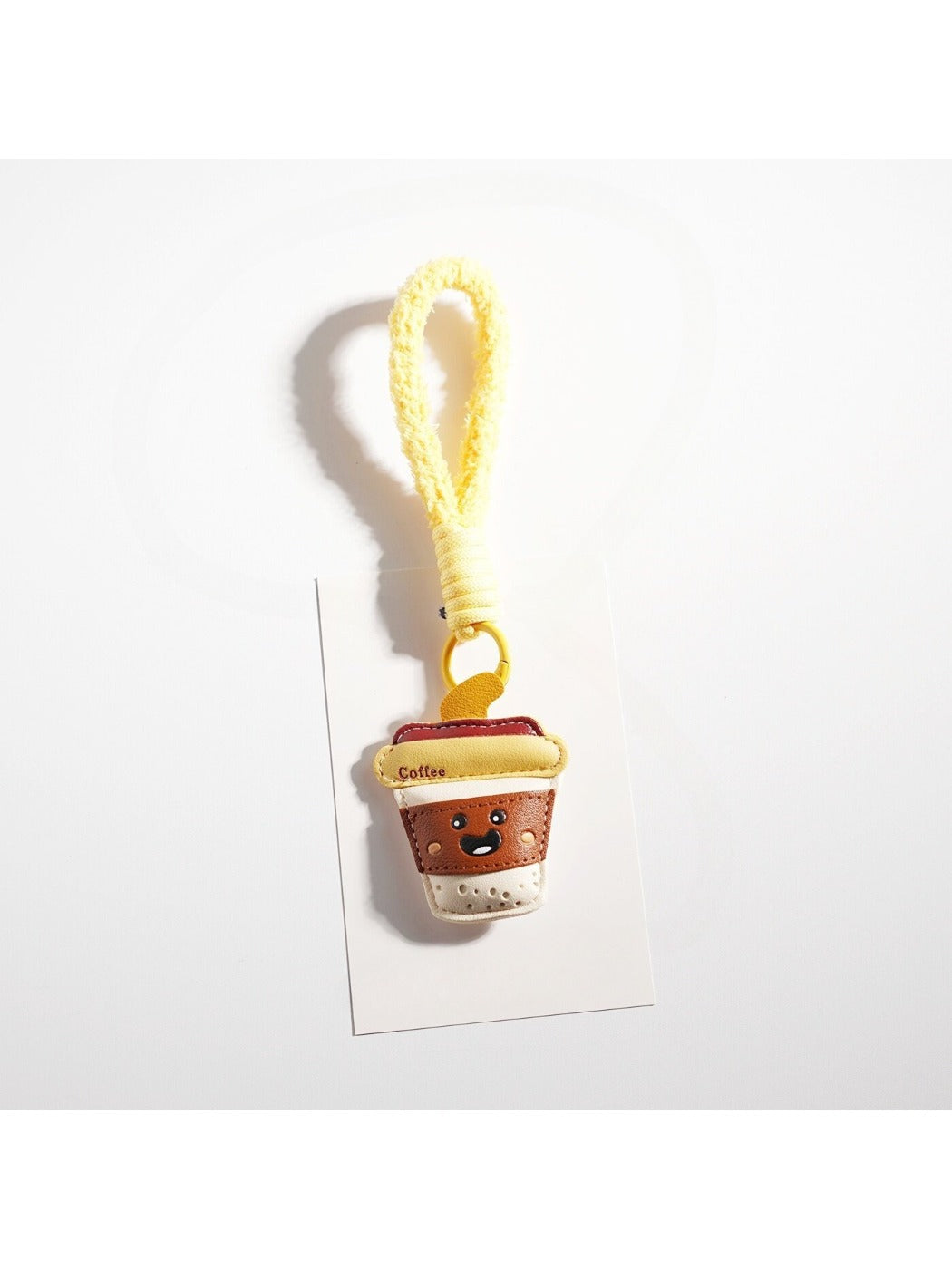 Keypus keychain packaging showing French fries and coffee cup design