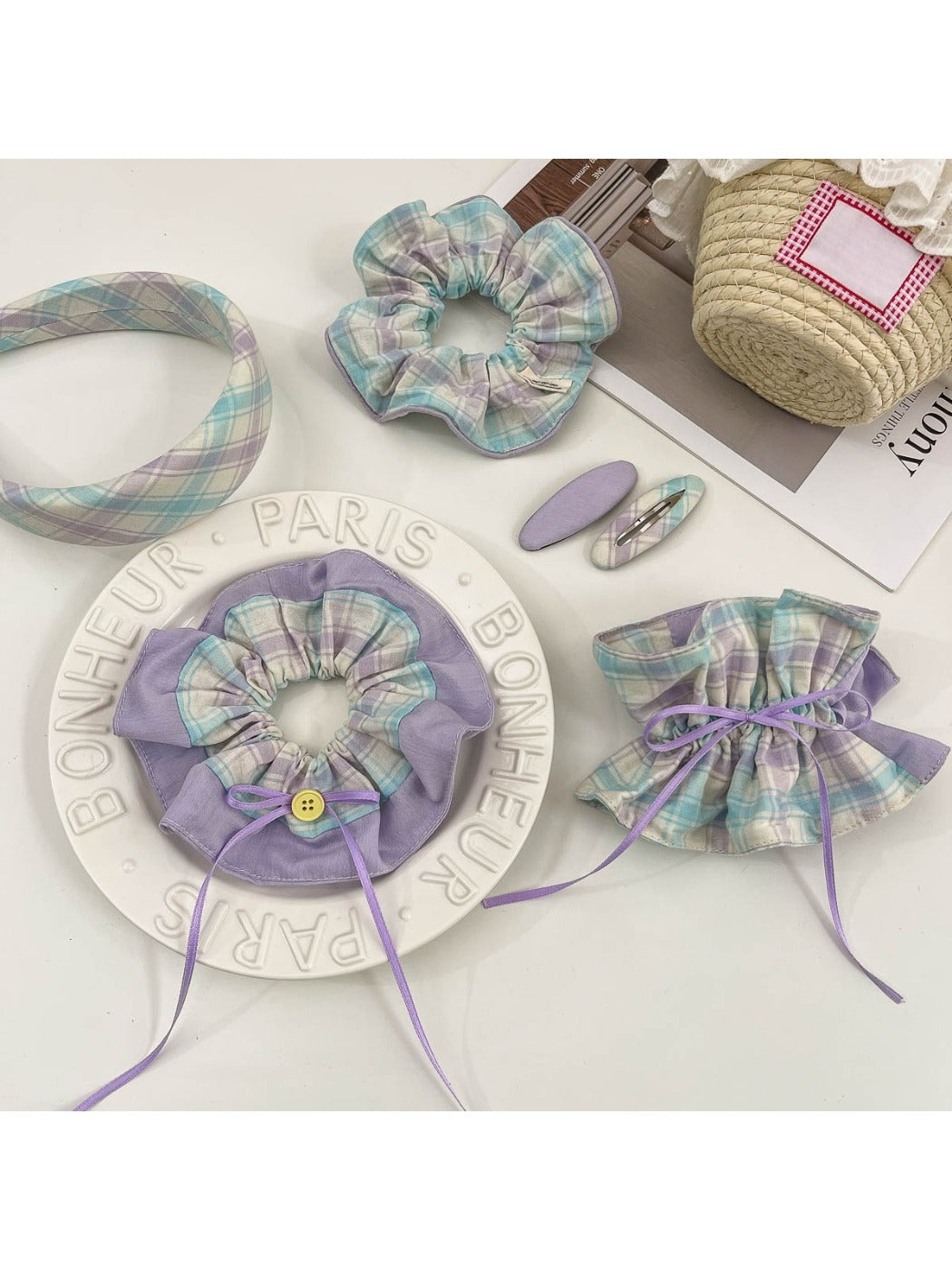 Close-up of plaid fabric scrunchie headband with gathered elastic detail
