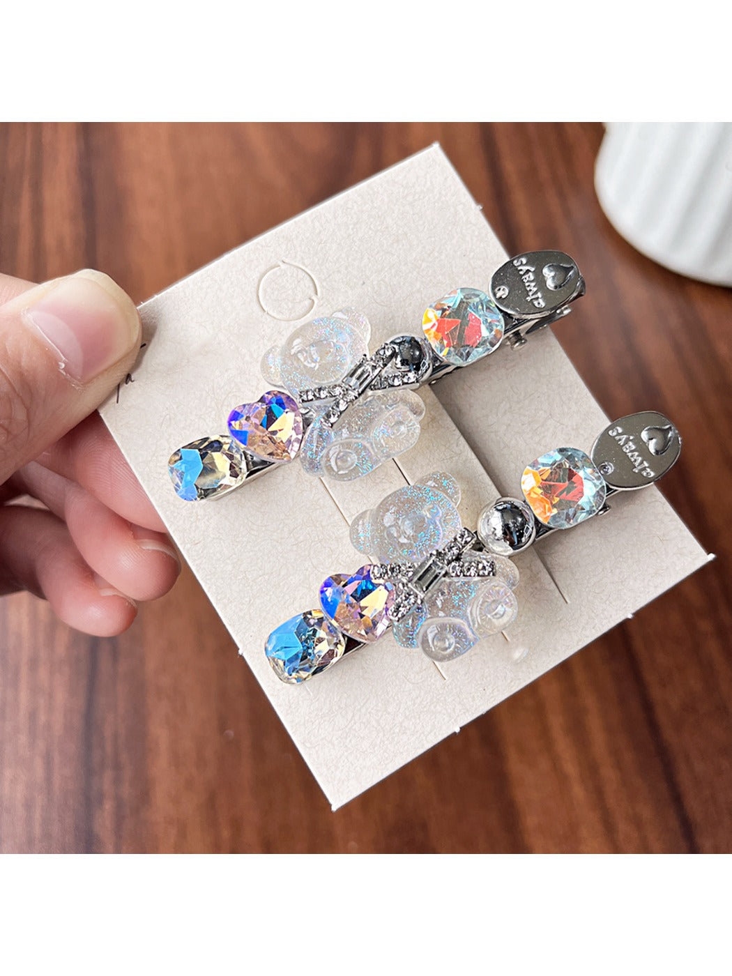 Beau bear hair clip clipped onto brown hair from side angle
