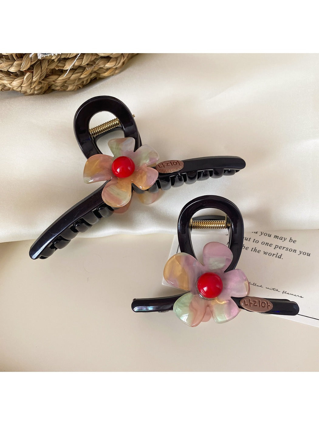 Side view of Beau flower claw clip highlighting curved prongs