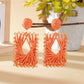 Earedge raffia wrapped square earrings photographed with natural lighting