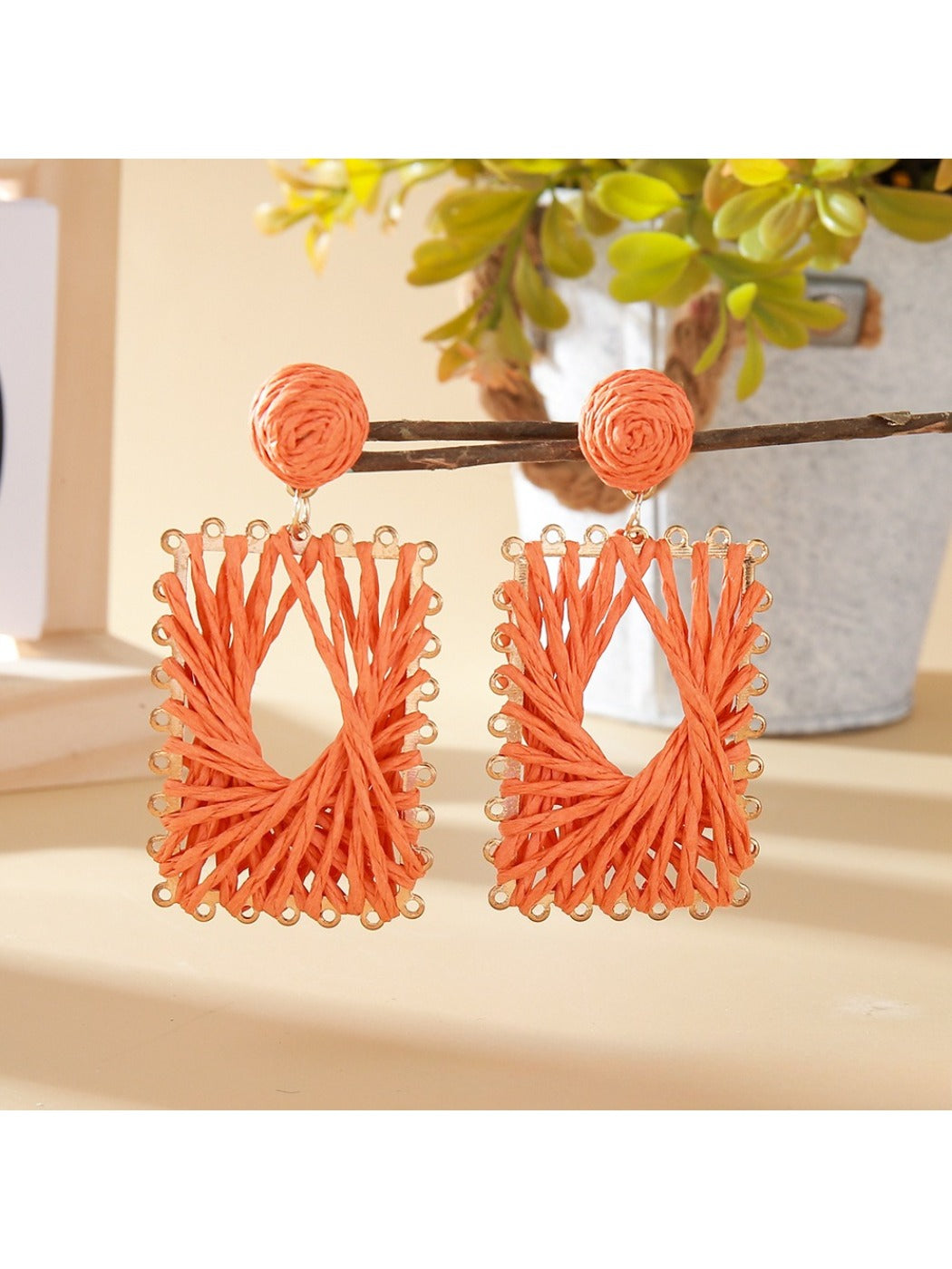 Earedge raffia wrapped square earrings photographed with natural lighting