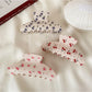 Beau half moon hair claw clip with colorful printed design on white background