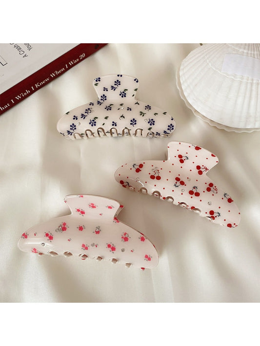 Beau half moon hair claw clip with colorful printed design on white background