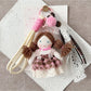 Close-up of Keypus doll keychain showing detailed fabric and facial features