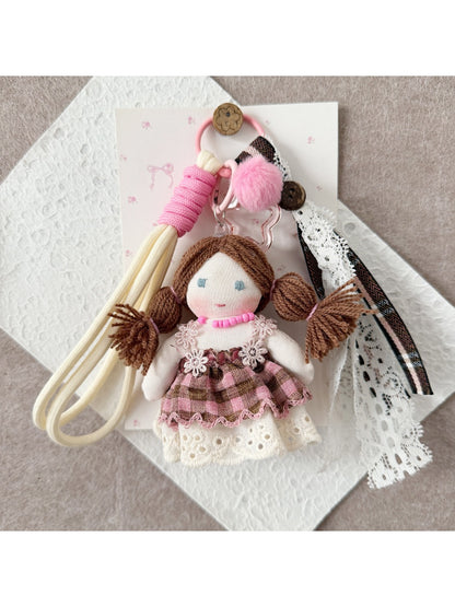 Close-up of Keypus doll keychain showing detailed fabric and facial features