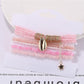 Lovra bracelet with multiple strands of colorful beads arranged in layers