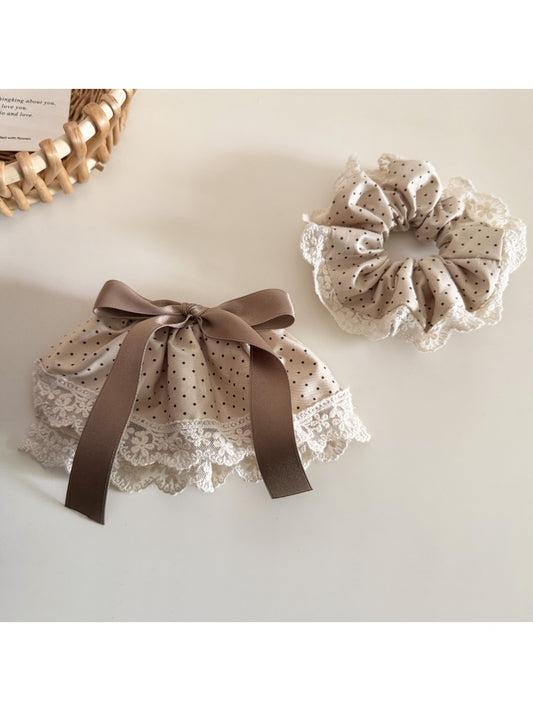 Beau Polka Dot Lace Scrunchie in black with white dots, showing full circular shape
