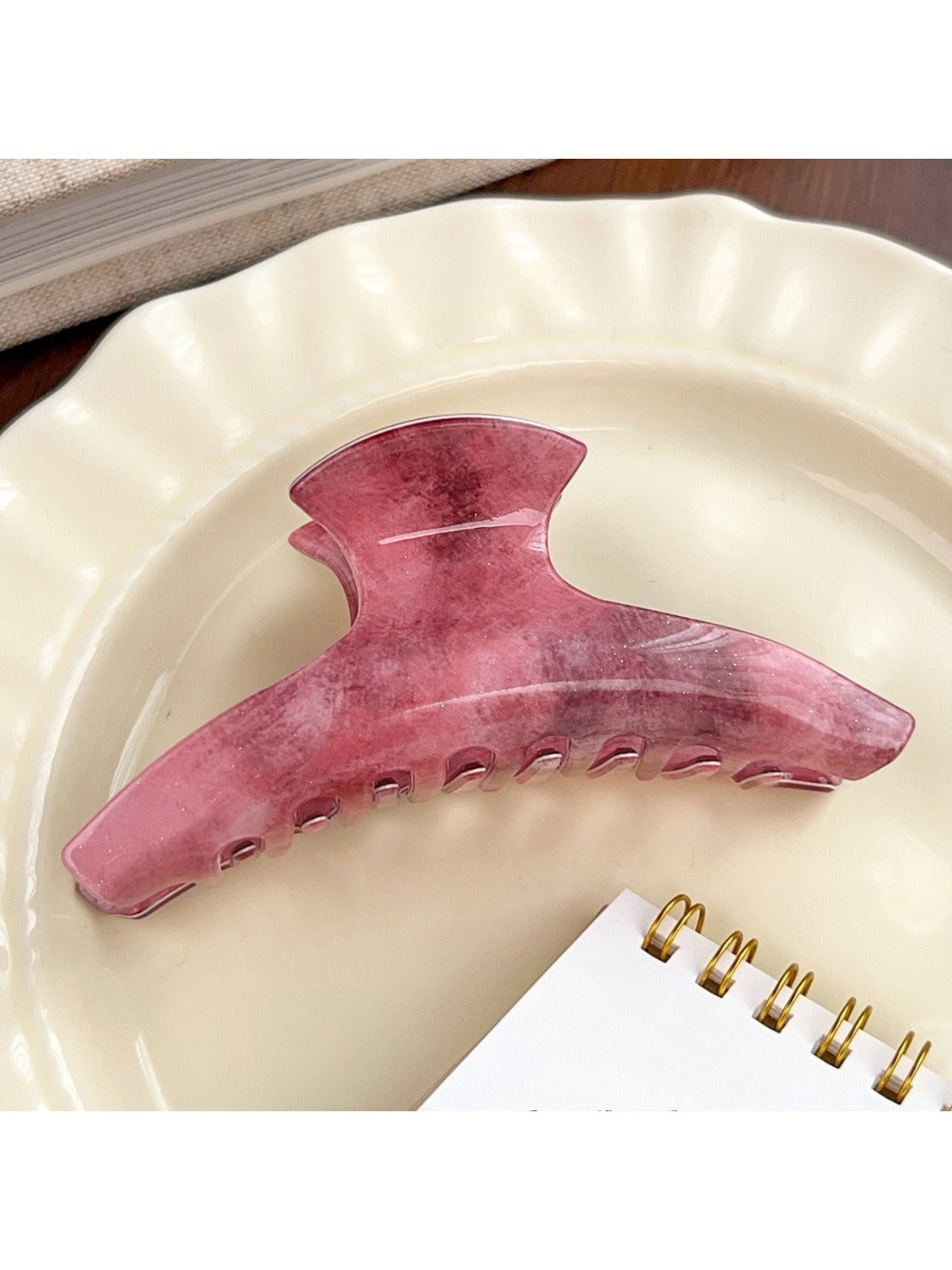 Beau pink ombre hair claw clip styled in long hair from back view