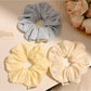 Gifty minimalist solid color scrunchie with delicate floral print on soft fabric