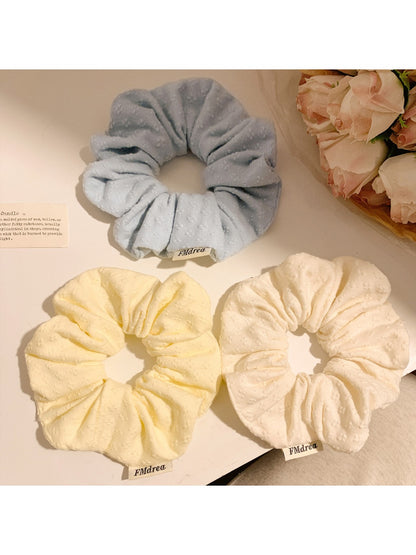 Gifty minimalist solid color scrunchie with delicate floral print on soft fabric