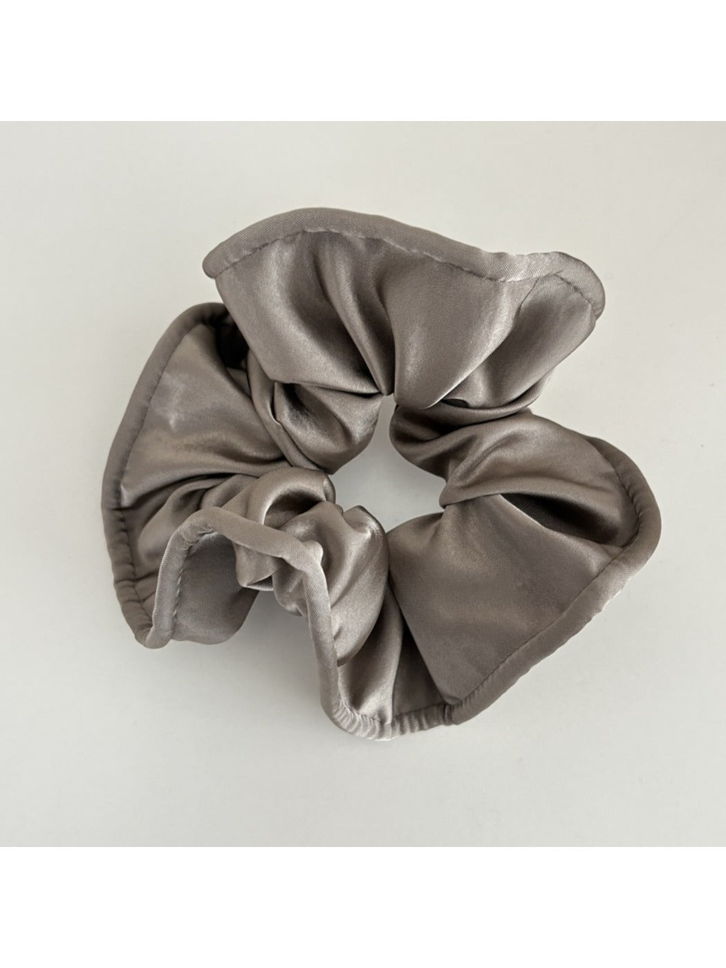 Model wearing Gifty satin finish scrunchie styled with loose hair