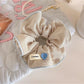 Gifty stripe scrunchie paired with matching hair accessories