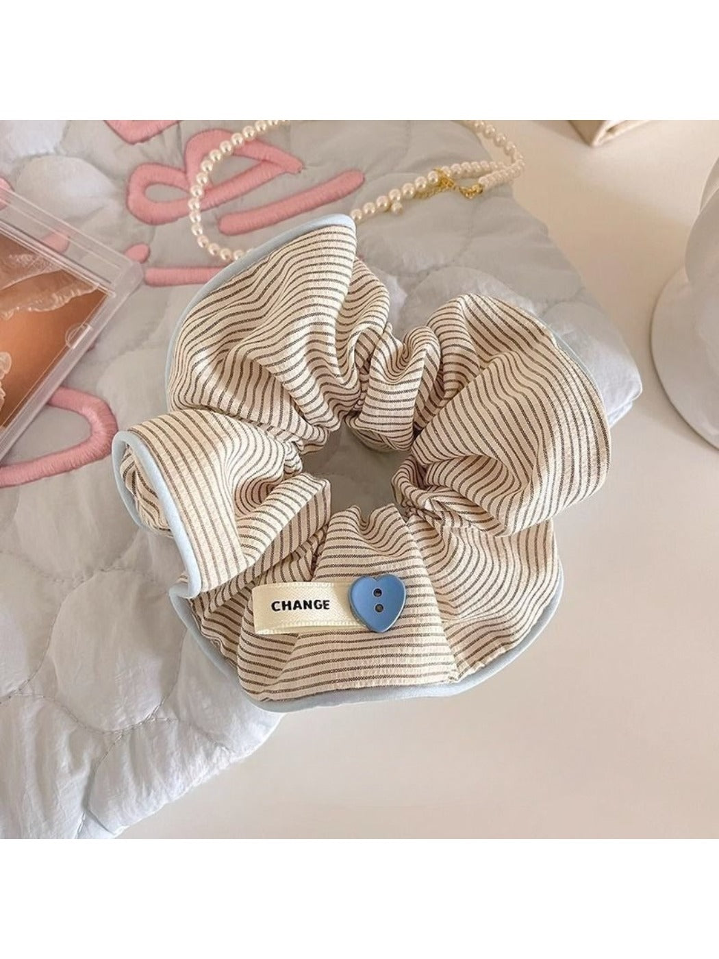 Gifty stripe scrunchie paired with matching hair accessories