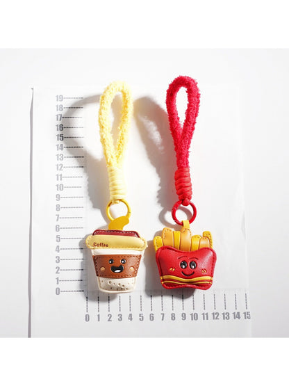 Keypus keychain attached to a set of keys with fries and coffee cup charms