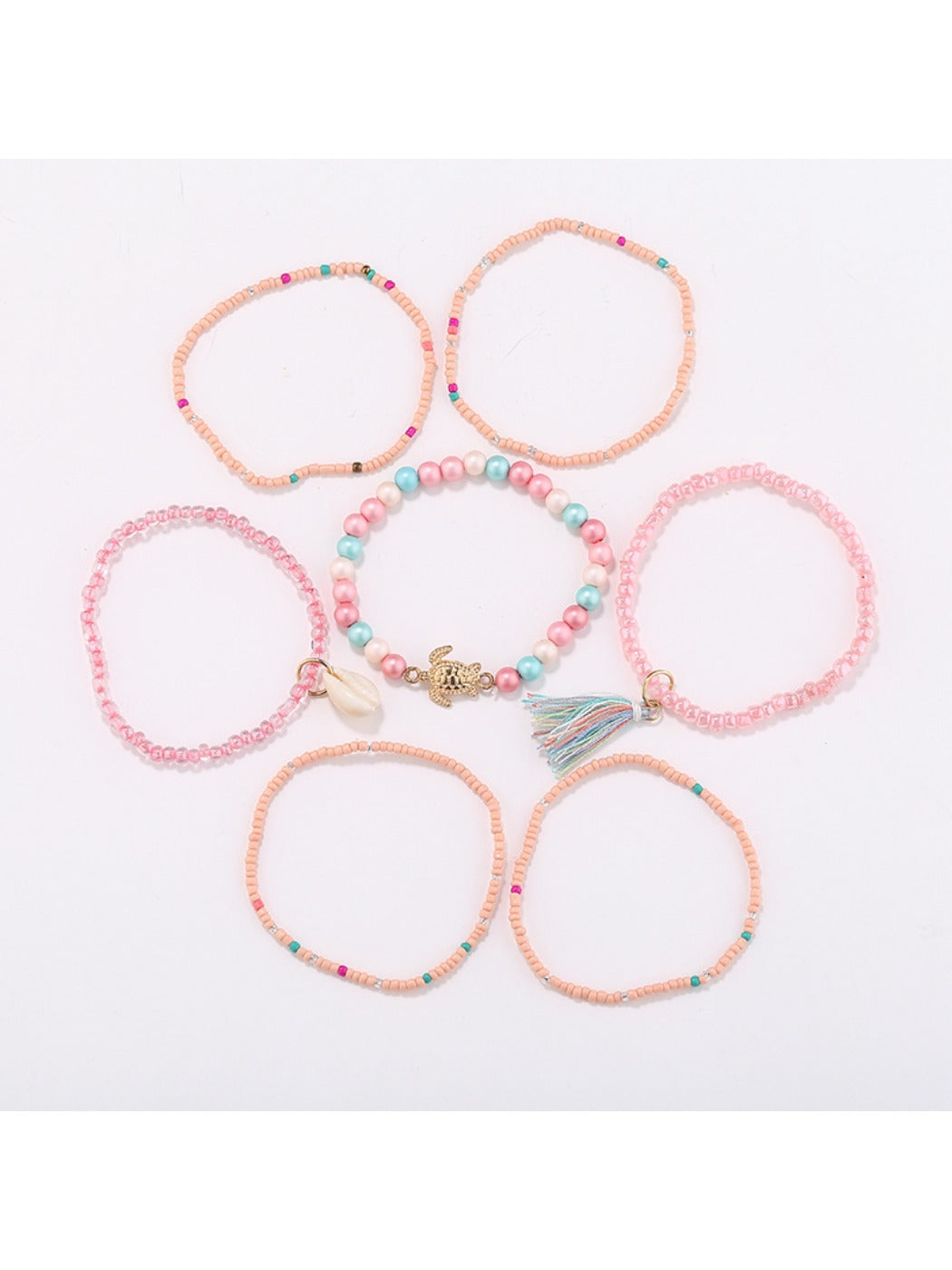 Lovra bracelet worn on wrist showing layered tassel and bead details in natural light