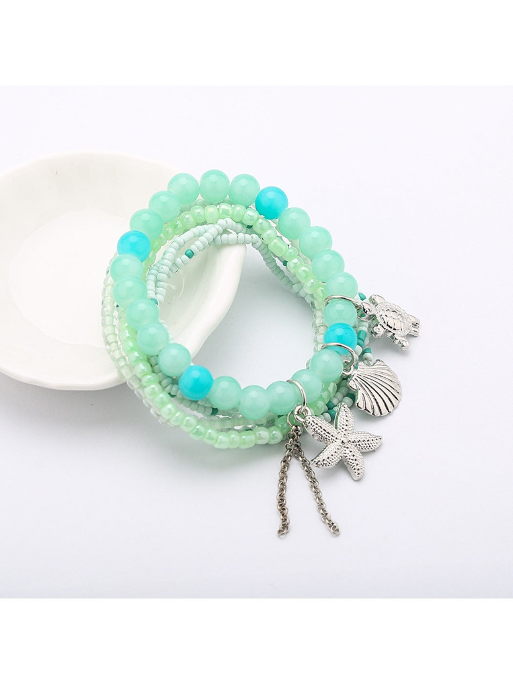 Lovra multi-row beaded bracelet styled with casual outfit on model's wrist