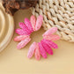 Model wearing Earedge color block raffia fan earrings with casual outfit