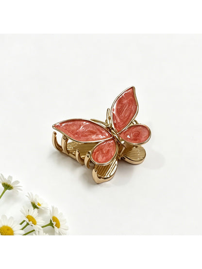 Beau butterfly hair clip securing medium-length hair on a model