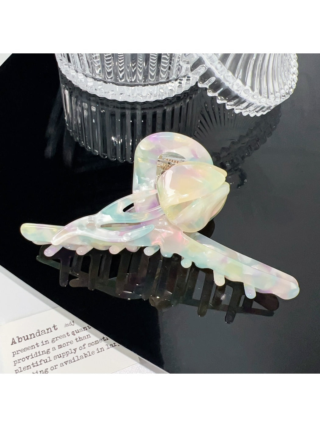 Beau colorful floral hair claw clip shown with packaging box