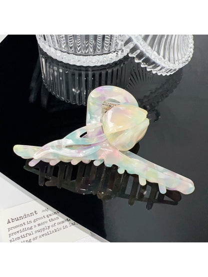 Beau colorful floral hair claw clip shown with packaging box