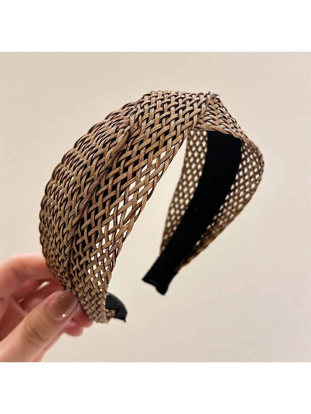 Model adjusting Gifty woven cross headband with casual outfit