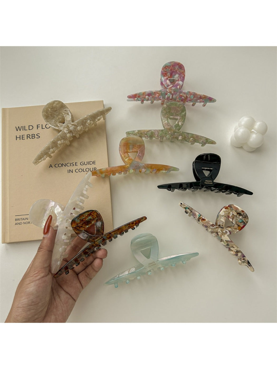 Beau claw clip held in hand showing size and gradient color transition