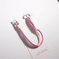 Colorful rope keychain attached to a set of keys