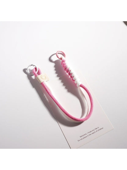 Colorful rope keychain attached to a set of keys