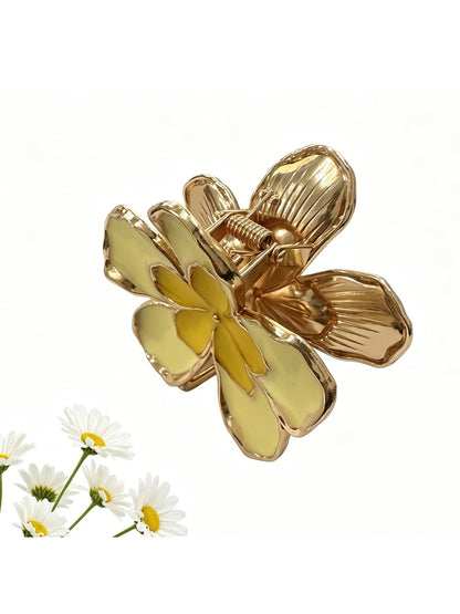 Close-up of Beau flower hair clip showing detailed fabric petals and textured gold center
