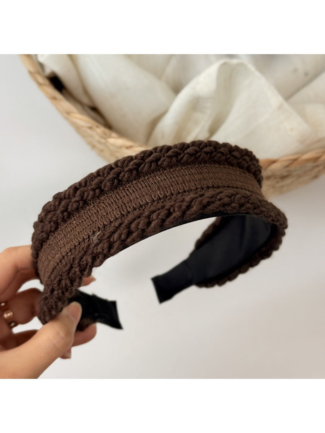 Gifty headband worn on model with light hair, showcasing its subtle elegance